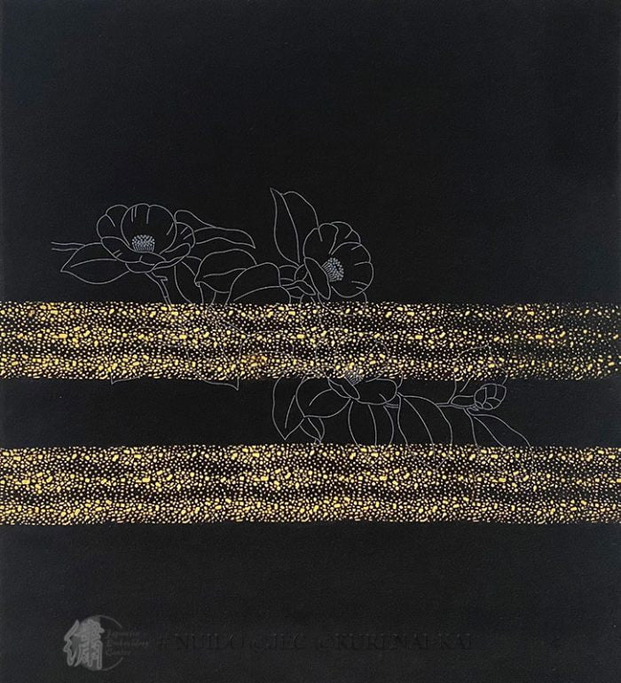 With gold leaf
